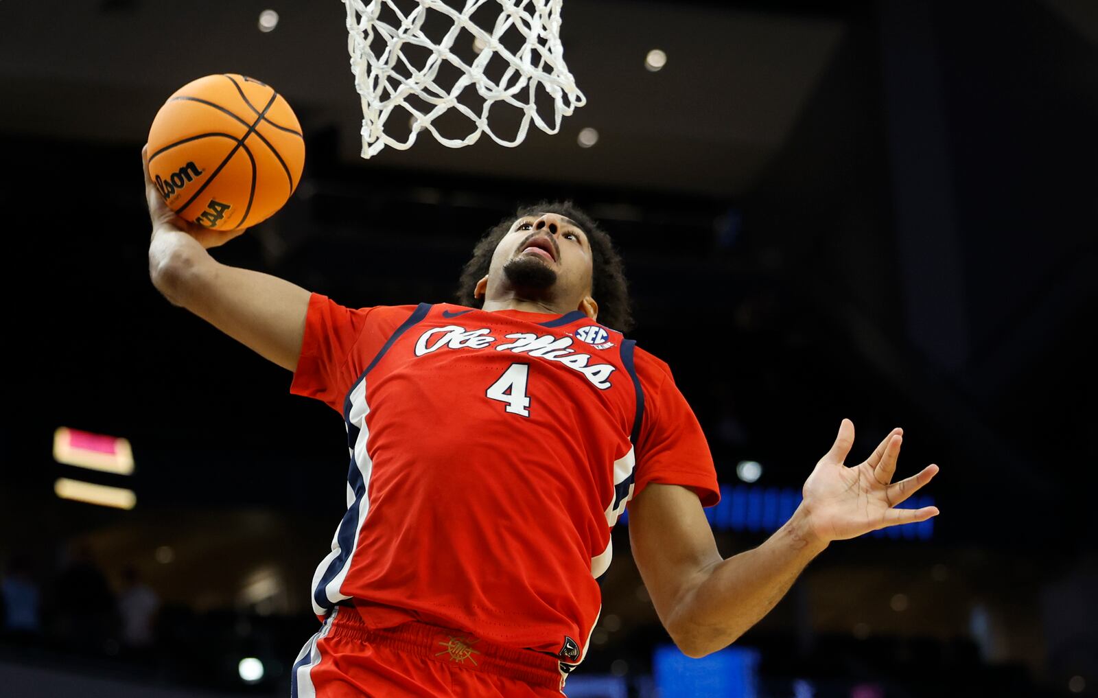 Mississippi forward Jaemyn Brakefield (4) dunks the ball against Iowa State during the second half in the second round of the NCAA college basketball tournament Sunday, March 23, 2025, in Milwaukee. (AP Photo/Jeffrey Phelps)