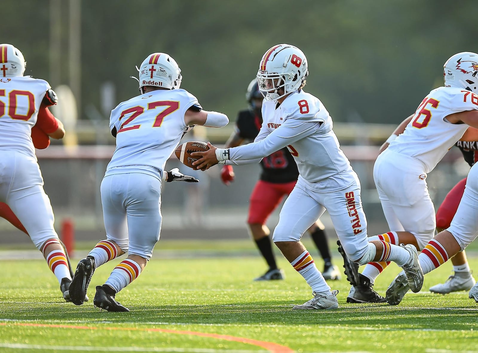 Fenwick quarterback Micah O'Connor looks to hand the ball off to running back Connor Schmuelling against Franklin earlier this season. Kyle Hendrix/CONTRIBUTED