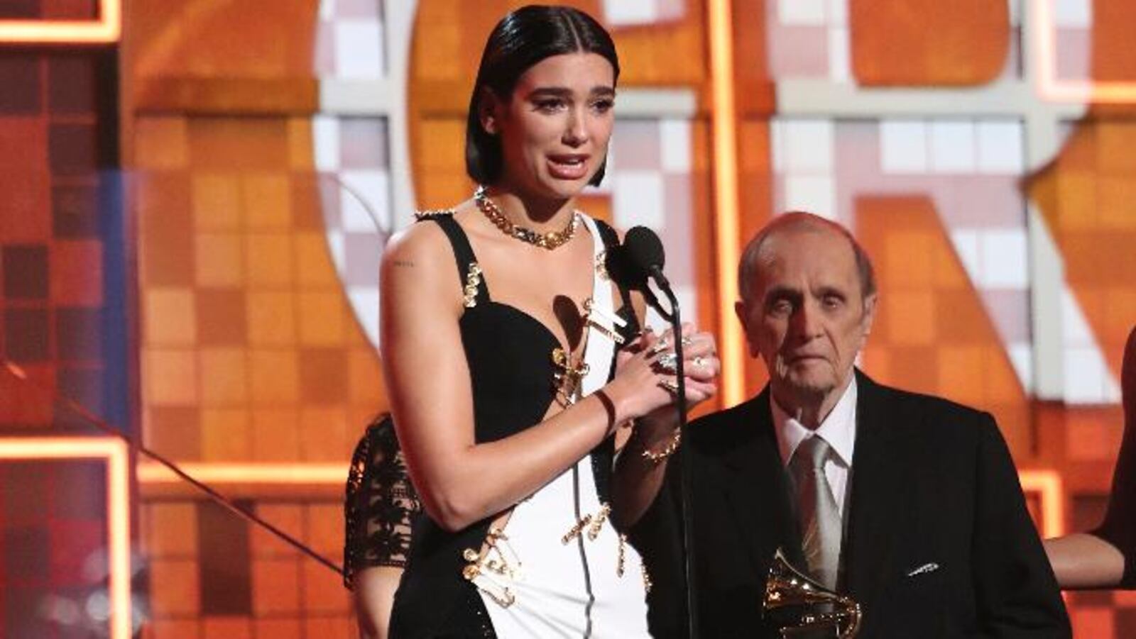 Dua Lipa accepts the award for best new artist at the 61st annual Grammy Awards on Sunday, Feb. 10, 2019, in Los Angeles. Looking on at right is presenter Bob Newhart.