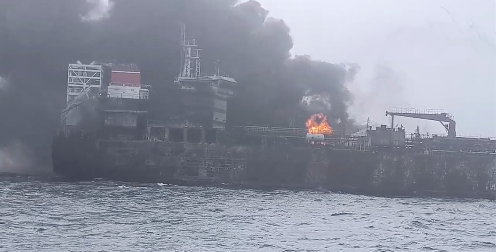 In this image taken from video provided by Denys Mezentsev, rescue crews work on site after a cargo ship was hit by a tanker carrying jet fuel for the U.S. military off eastern England, Monday, March 10, 2025, setting both vessels ablaze and sending fuel pouring into the North Sea. (Denys Mezentsev via AP)