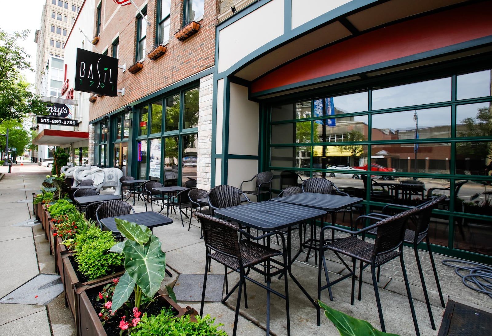 The outdoor cafe area of Basil 1791 in Hamilton is a model of what city leaders have in mind for outdoor dining areas, which can help businesses, particularly during the coronavirus crisis. NICK GRAHAM/STAFF