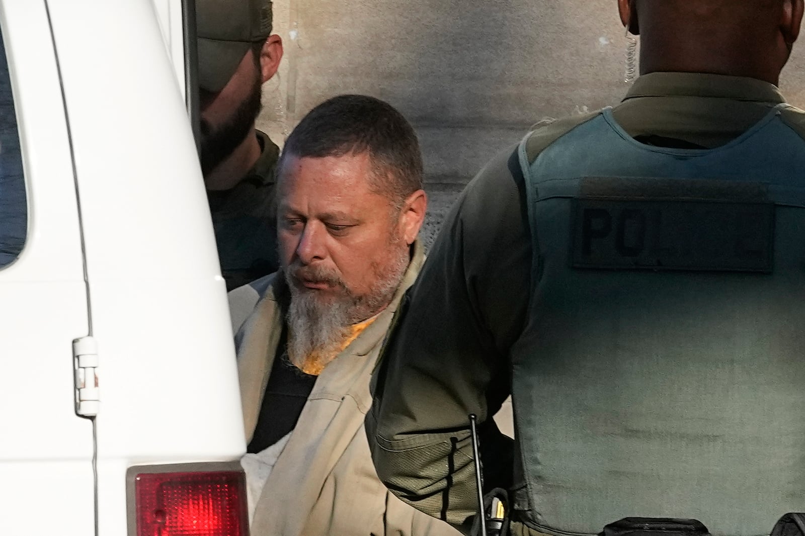 FILE - Officers escort Richard Allen out of the Carroll County Courthouse following a hearing, Nov. 22, 2022, in Delphi, Ind. (AP Photo/Darron Cummings, File)