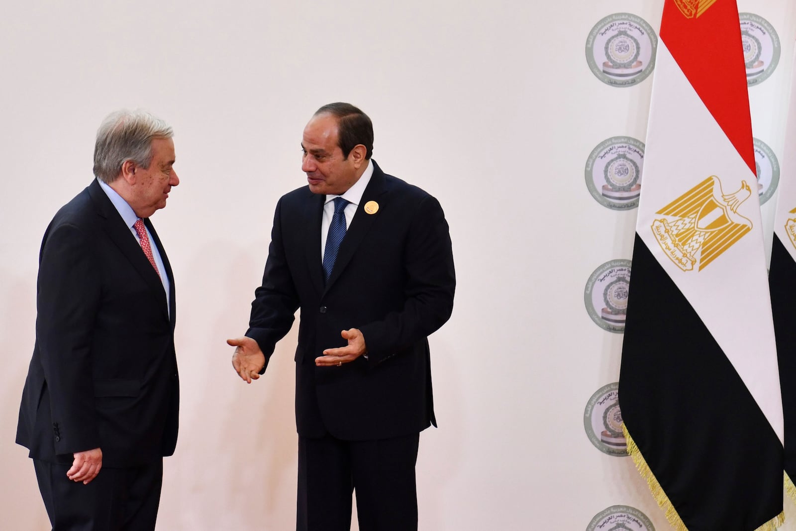 In this photo provided by Egypt's presidency media office, Egyptian President Abdel-Fattah el-Sissi, right, greets United Nations Secretary General Antonio Guterres during the emergency Arab summit at Egypt's New Administrative Capital, just outside Cairo, Tuesday, March 4, 2025. (Egyptian Presidency Media Office via AP)