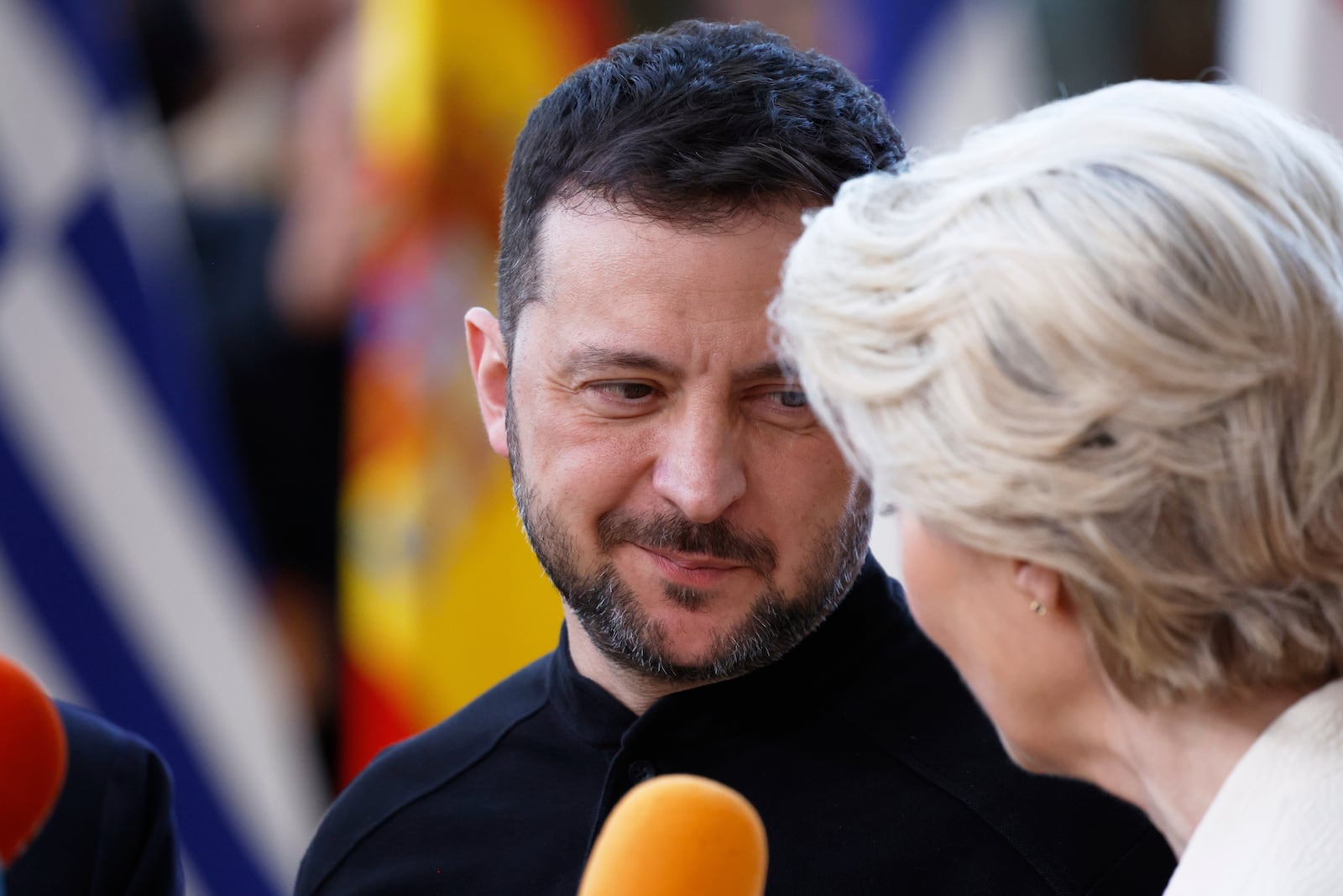 European Commission President Ursula von der Leyen, right, and Ukraine's President Volodymyr Zelenskyy speak with the media as they arrive for an EU Summit at the European Council building in Brussels, Thursday, March 6, 2025. (AP Photo/Omar Havana)