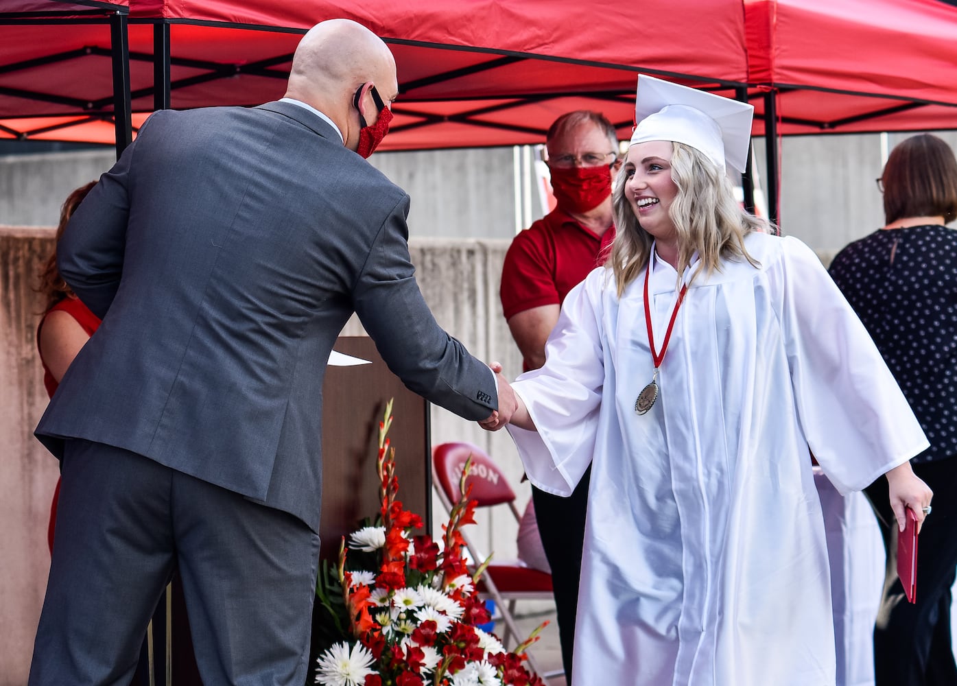 Madison High School drive-thru graduation ceremony at Land of Illusion