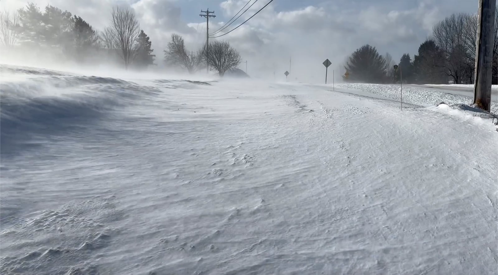 Snow blows in the high winds in Lowville, N.Y. on Thursday, Dec. 12, 2024. (AP Photo/Cara Anna)