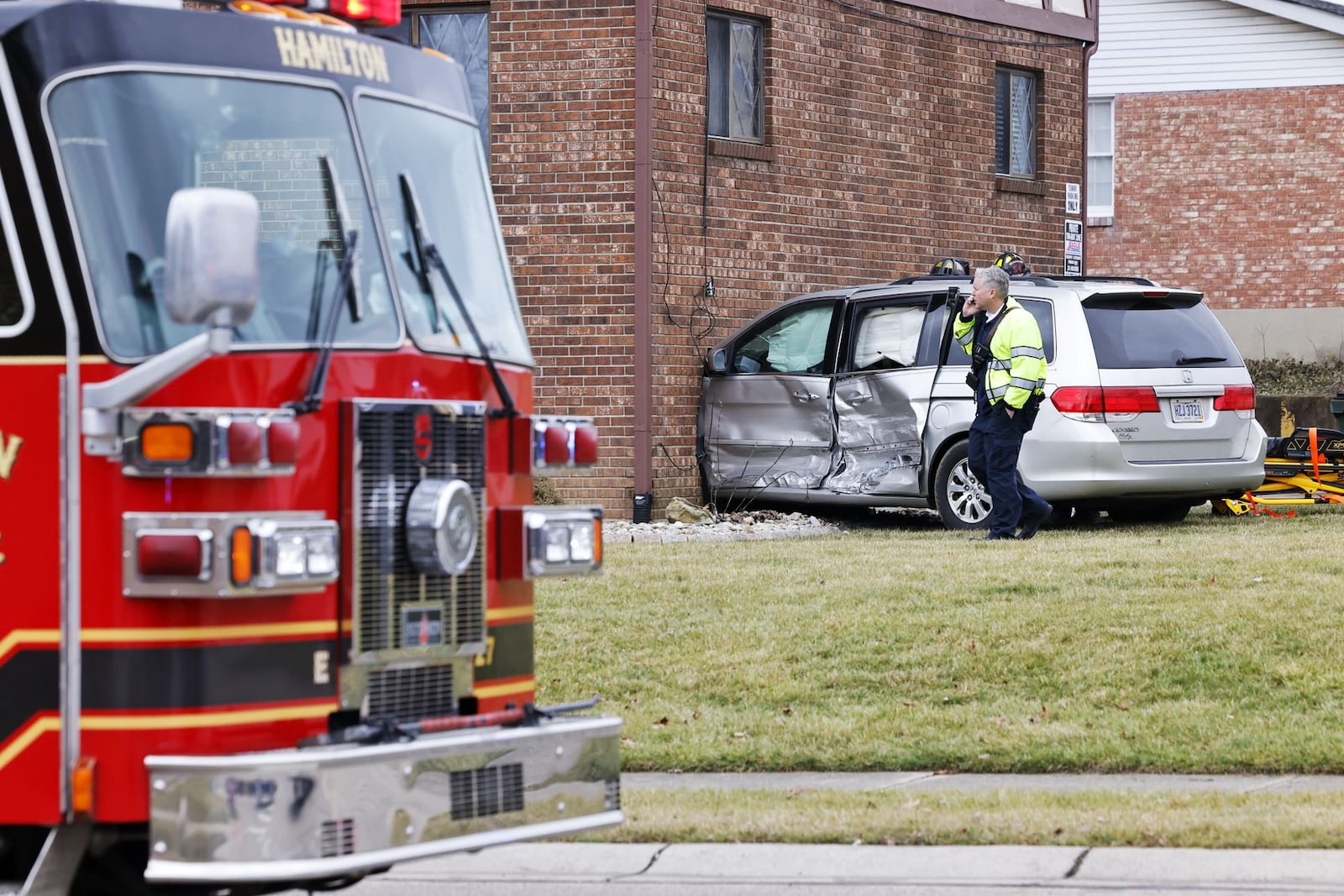 A van crashed into apartment at intersection of NW Washington Boulevard and Cleveland Avenue on Wednesday afternoon in Hamilton. One person in the van was transported to the hospital by ambulance. NICK GRAHAM/STAFF