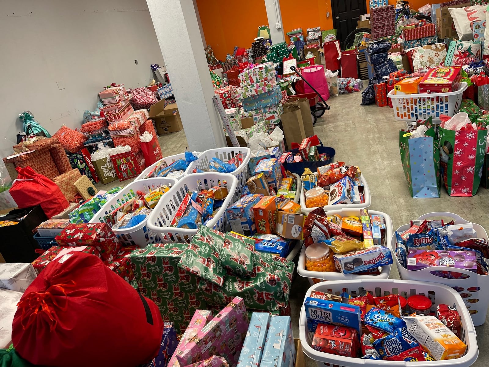 Gifts donated from businesses and volunteers housed in a Franklin space donated by Rod Litteral of First Realty totaled more than 2,400 this year for more than 160 less fortunate children, according to organizer Kim Bilbrey. CONTRIBUTED