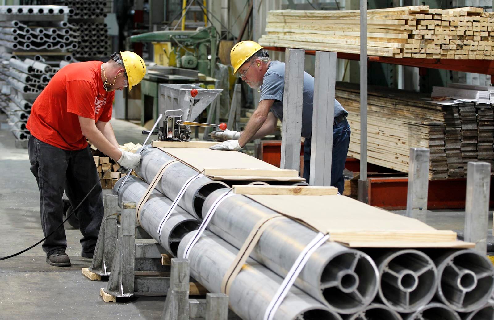 Magnode Corporation employees band extruded aluminum at the company’s Trenton plant in 2012. STAFF FILE PHOTO