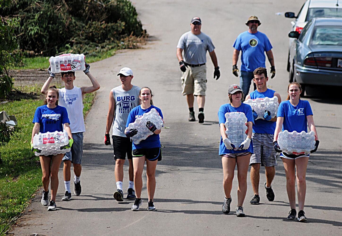 PHOTOS: Tornado-damaged communities dig out, clean up