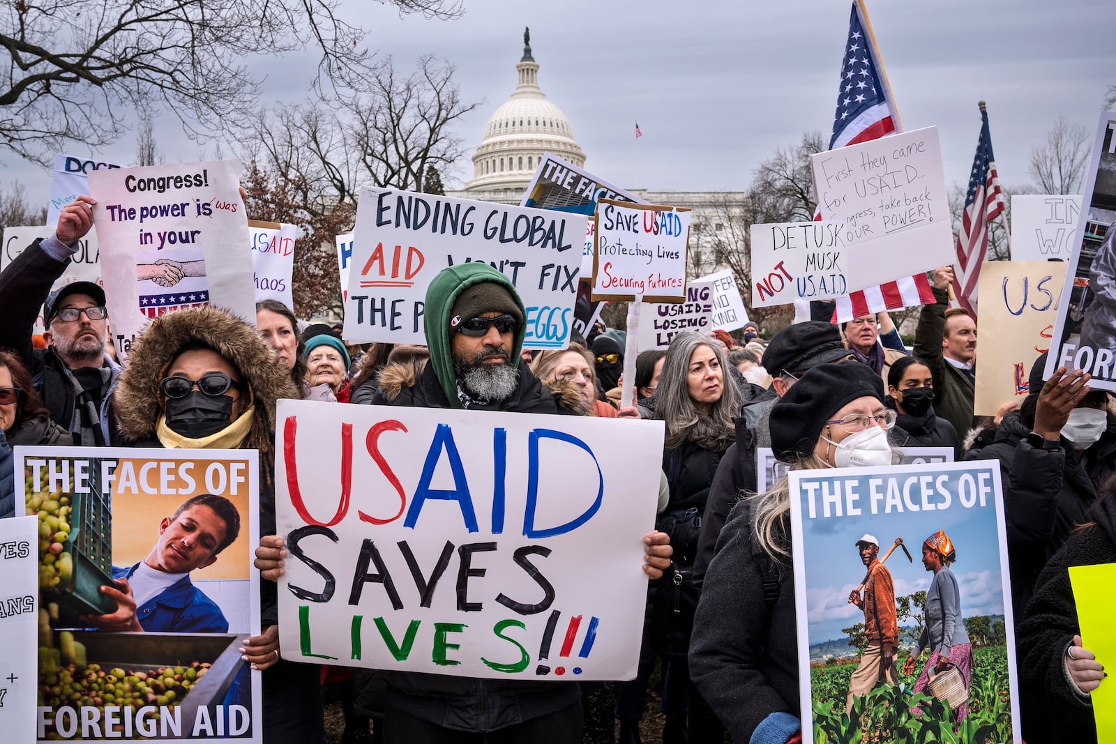 Demonstrators and lawmakers rally against President Donald Trump and his ally Elon Musk as they disrupt the federal government, including dismantling the U.S. Agency for International Development, which administers foreign aid approved by Congress, on Capitol Hill in Washington, Wednesday, Feb. 5, 2025. (AP Photo/J. Scott Applewhite)