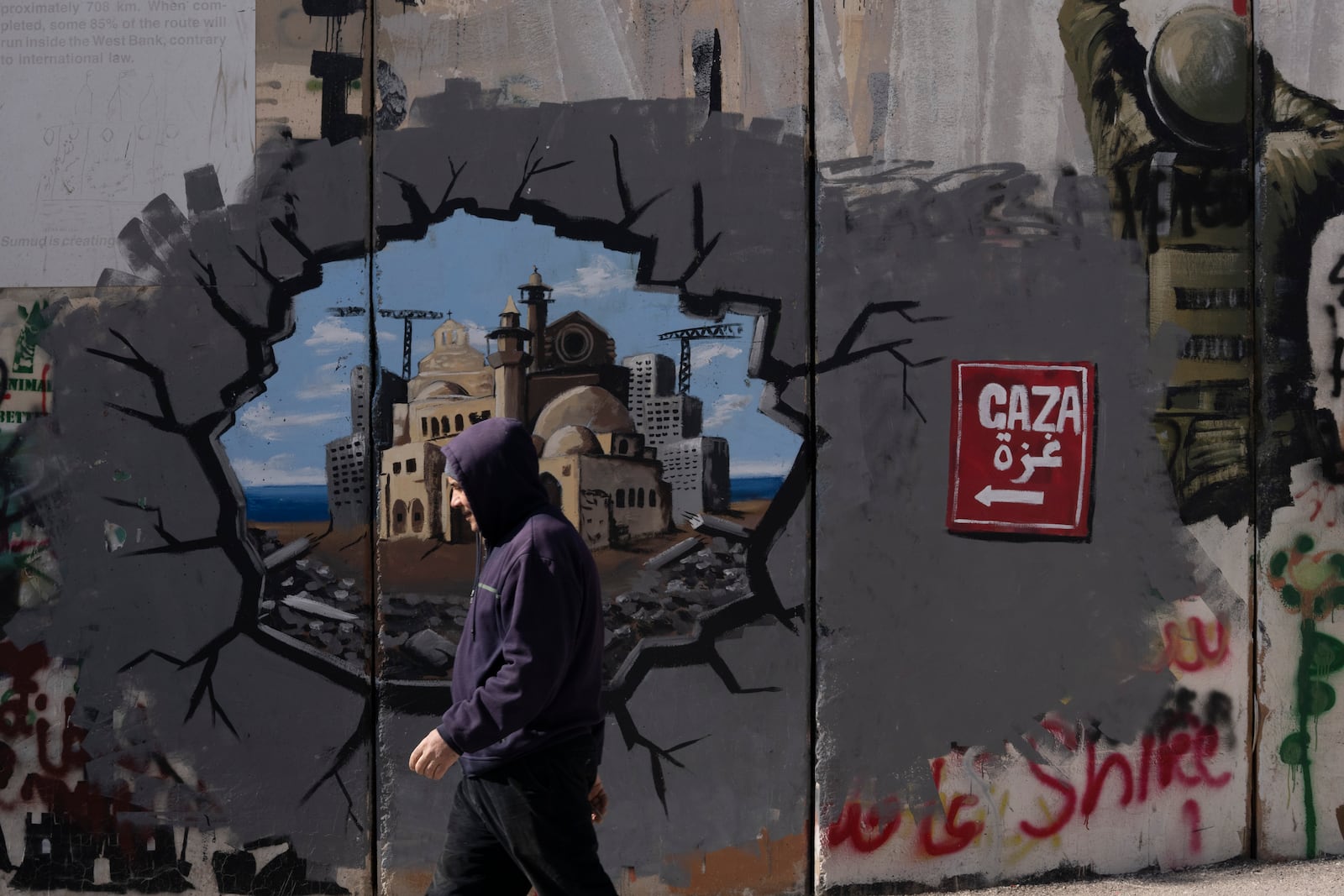 Graffiti on Israel's separation barrier depicts the Gaza Strip, in the West Bank city of Bethlehem, Friday, Feb. 14, 2025. (AP Photo/Maya Alleruzzo)