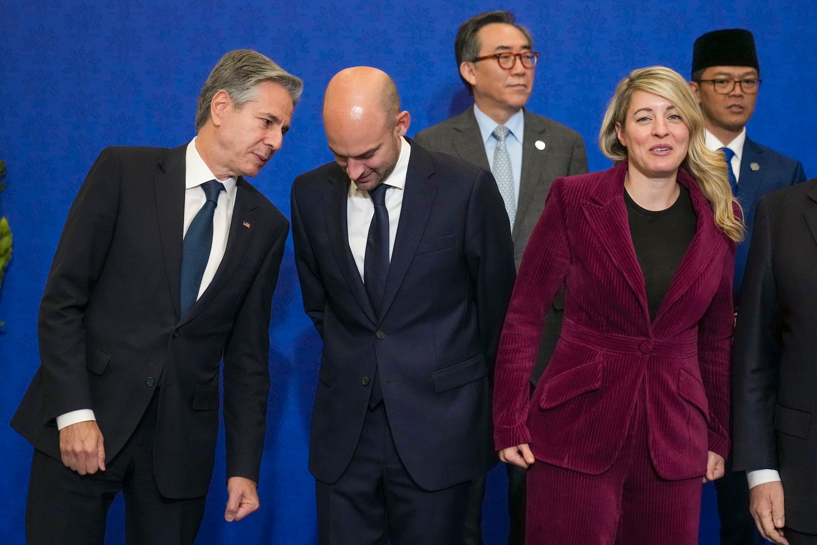 From left front row, U.S. Secretary of State Antony Blinken, foreign MInisters of France, Jean-Noël Barrot, Canada, Melanie Joly, wait for a family photo with, second row from left, foreign Ministers of South Korea, Tae-yul Cho, and Indonesia, Sugiono at the G7 of foreign Ministers in Fiuggi, some 70 kilometers south-east of Rome, Tuesday, Nov. 26, 2024. (AP Photo/Alessandra Tarantino, Pool)