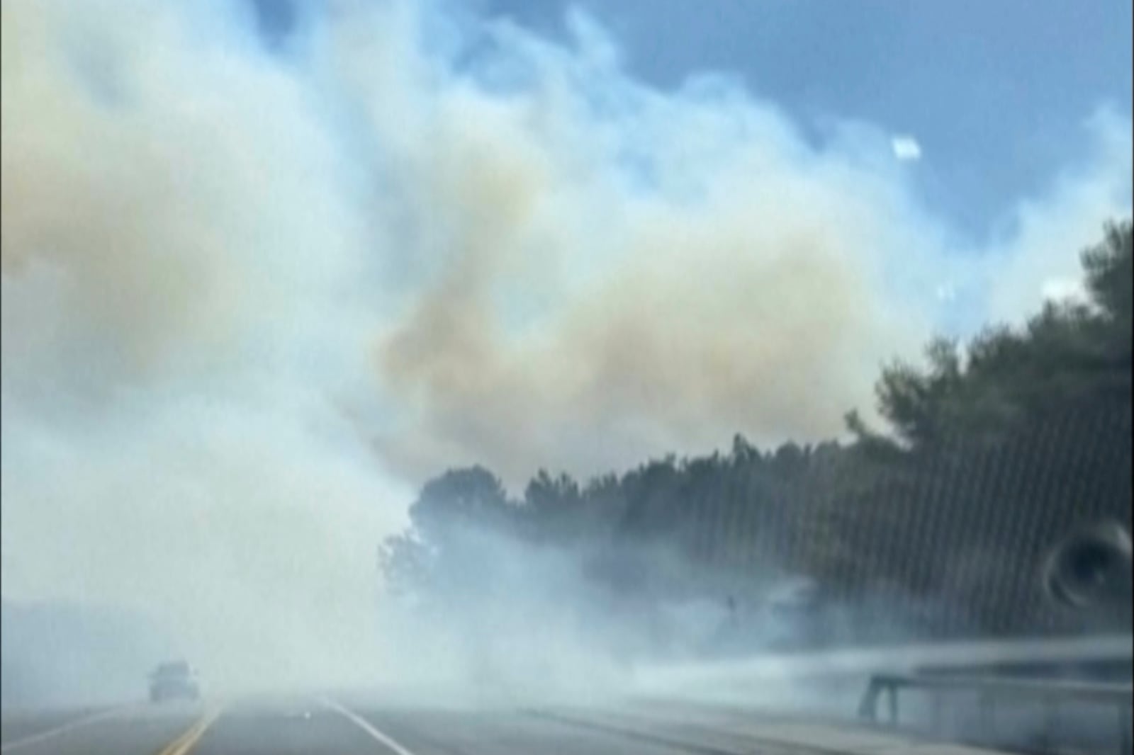 This image from video provided by Andrew Tallon shows smoke from fires in New York's Long Island, on Saturday, March 8, 2025, seen from Southampton, N.Y. (Andrew Tallon via AP)