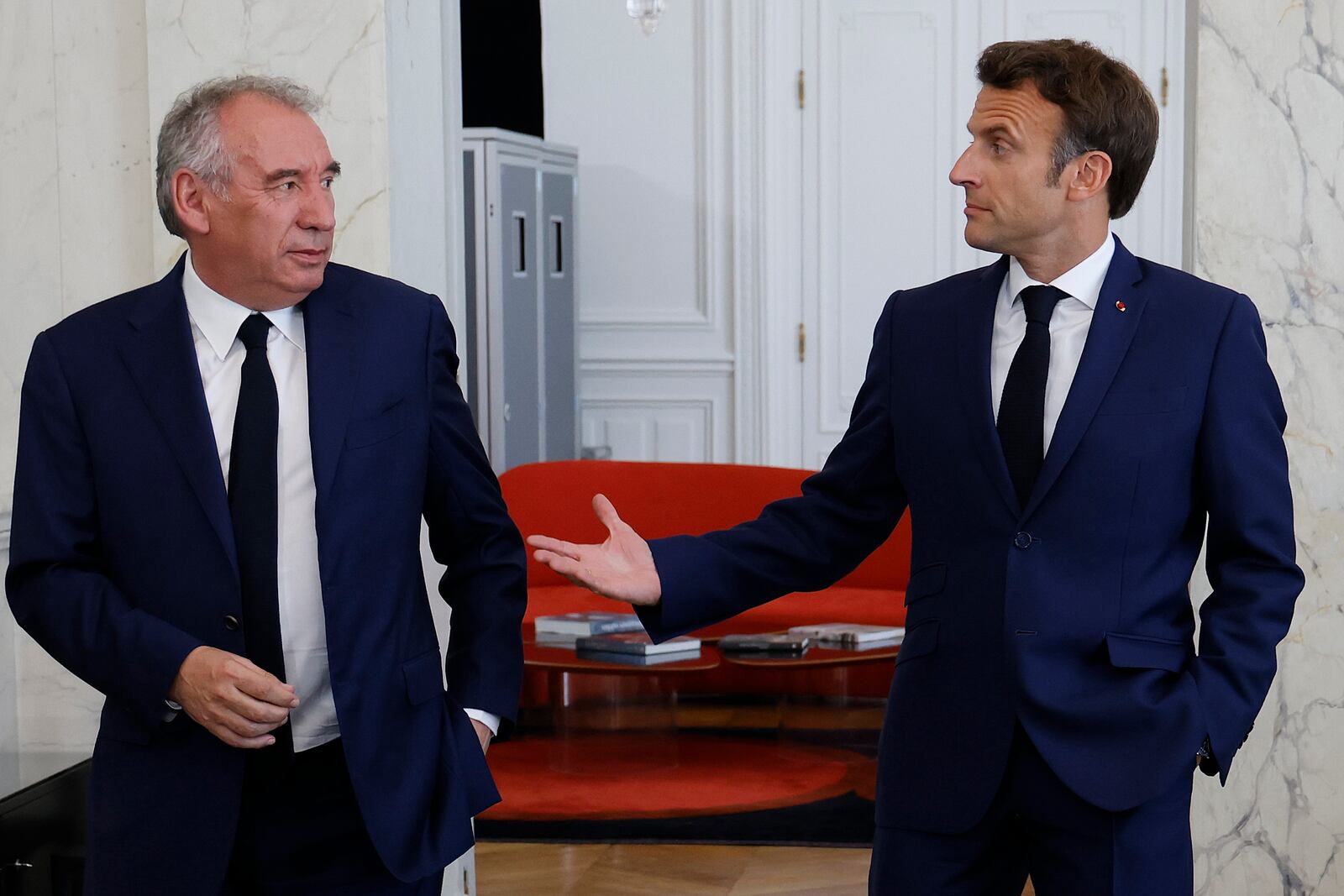 FILE - French President Emmanuel Macron, right, meets French centrist party MoDem (Mouvement Democrate) leader Francois Bayrou at the Elysee Palace in Paris, France, Tuesday, June 21, 2022. French President Emmanuel Macron names key centrist ally François Bayrou as new prime minister Friday Dec.13 2024. (Ludovic Marin/Pool photo via AP, File)