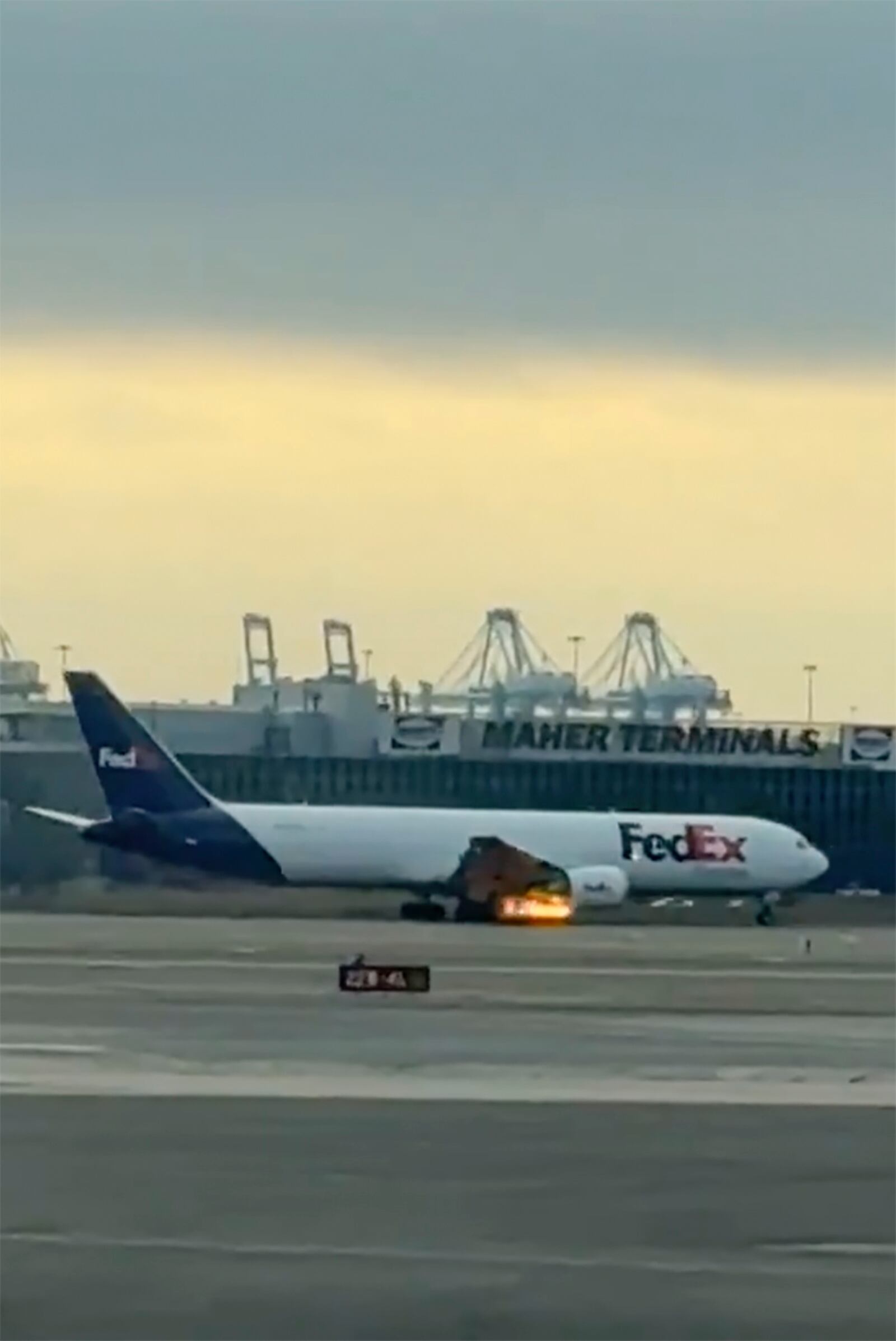 In this photo provided by Kenneth Hoffman, a FedEx cargo plane makes an emergency landing at Newark Liberty International Airport on Saturday, March 1, 2025 in Newark, N.J. (Kenneth Hoffman via AP)