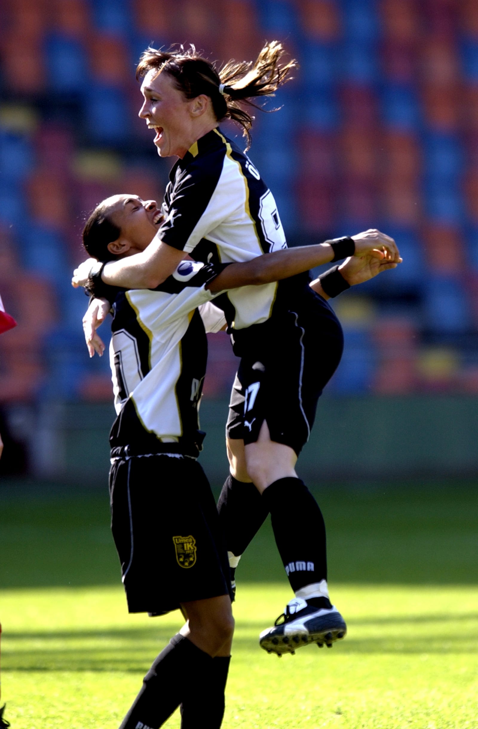 Umea's Frida Ostberg, right, is congratulated by Marta da Silva after scoring their side's second goal of the game during the UEFA Women’s Cup final between Umea IK and Frankfurt at the Rasunda national soccer arena in Stockholm, Sweden, May 8, 2004. (Janerik Henriksson/TT News Agency via AP)