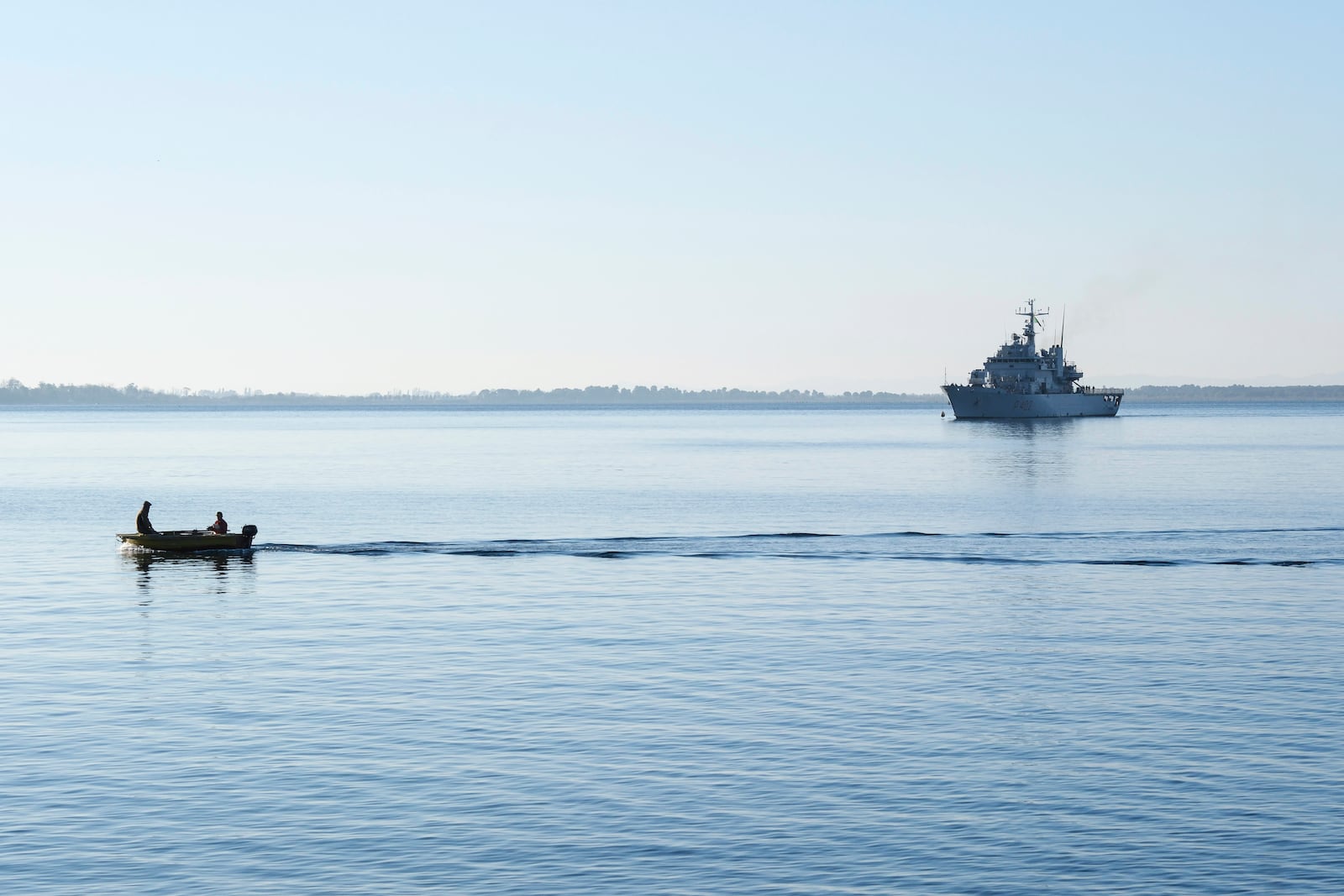 The Italian navy ship Libra approaches the port of Shengjin, northwestern Albania, Friday, Nov. 8, 2024, with the second group of eight migrants intercepted in international waters to be processed there in a reception facility despite the failure with the first group last month.(AP Photo/Vlasov Sulaj)