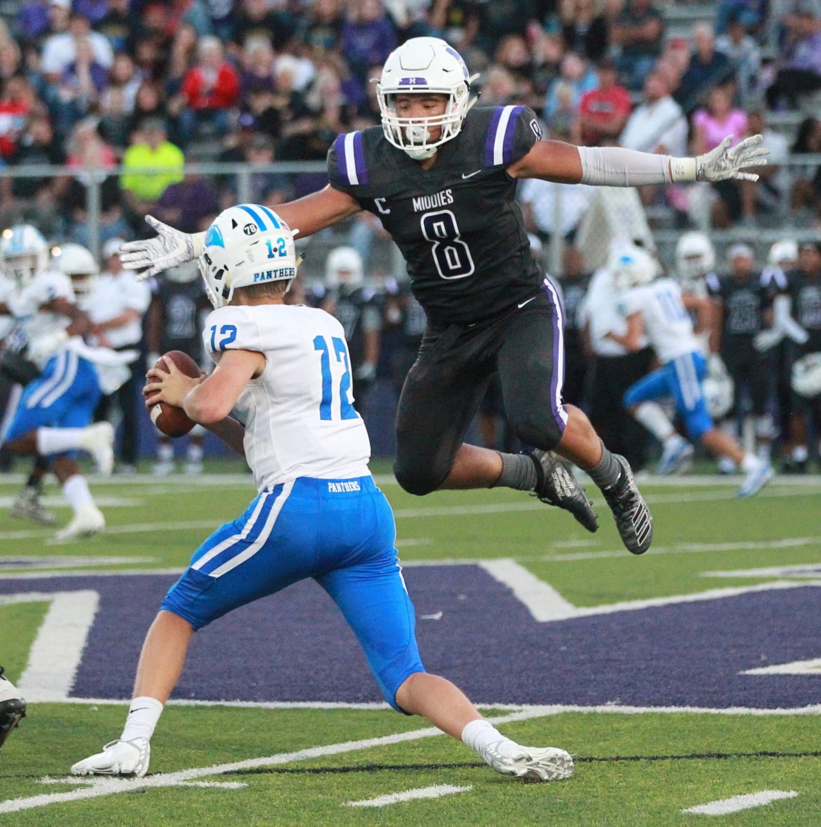 Middletown defender Kamron Cooper takes flight against Springboro QB Mikey Appel. Springboro defeated host Middletown 37-14 in a Week 2 high school football game at Barnitz Stadium on Friday, Sept. 7, 2019. MARC PENDLETON / STAFF