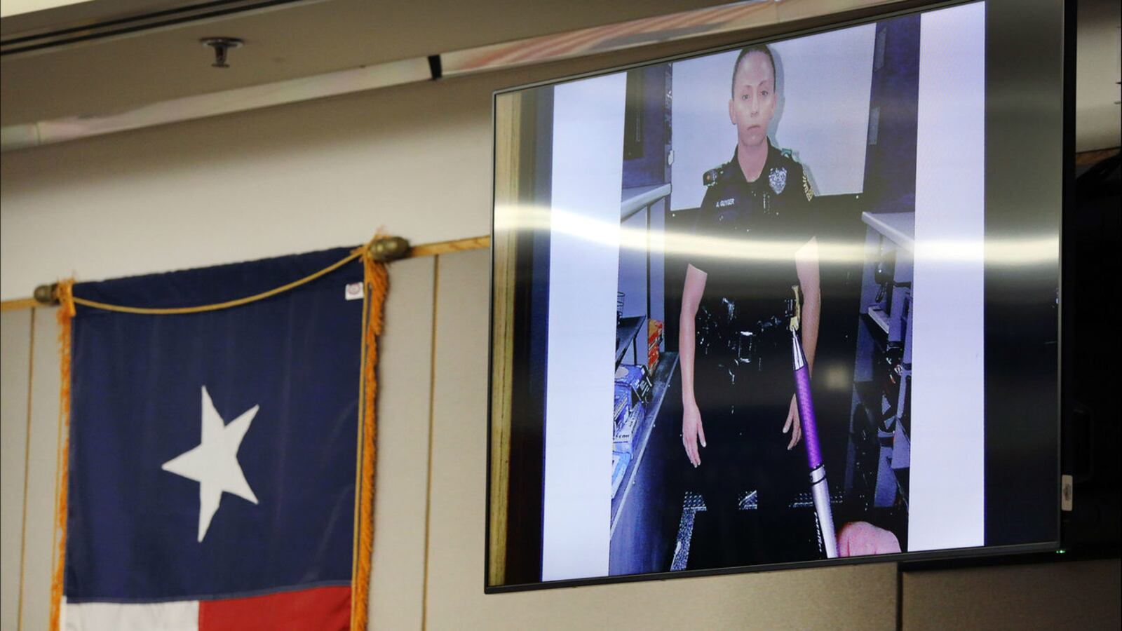 An evidence photo shows ex-Dallas police officer Amber Guyger in uniform the night of Sept. 6, 2018, when she fatally shot a neighbor, Botham Jean, after mistaking his apartment for her own. Guyger is on trial for murder.