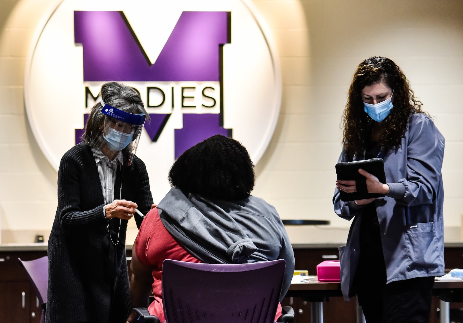 Middletown City Schools employees were some of the first teachers in Ohio to receive their Covid-19 vaccines Wednesday, January 27, 2021 at Middletown High School. NICK GRAHAM / STAFF