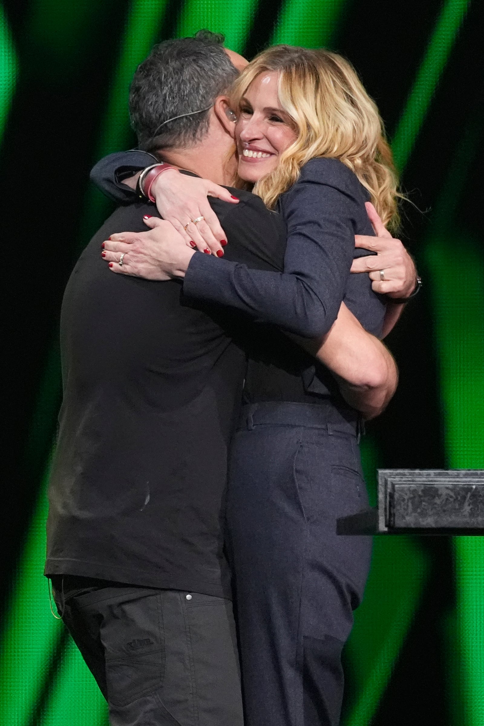 Dave Matthews, left, and Julia Roberts embrace during the 39th Annual Rock & Roll Hall of Fame Induction Ceremony on Saturday, Oct. 19, 2024, at Rocket Mortgage FieldHouse in Cleveland. (AP Photo/Chris Pizzello)