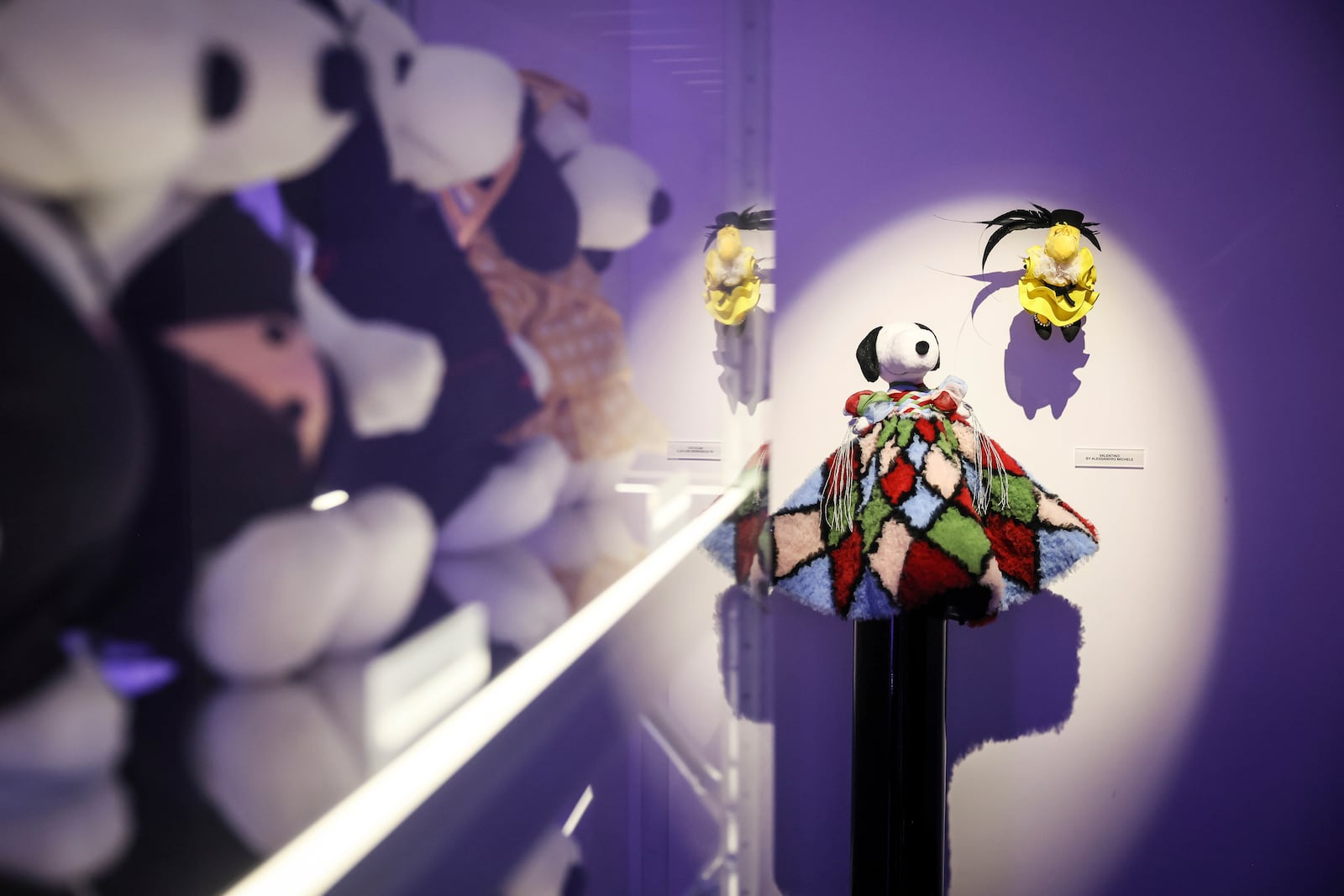 Figurines representing Snoopy wear creations as part of Peanuts' 75th Anniversary, at the Snoopy In Style exhibition that runs from March 22 through April 5, in Paris Thursday, March 20, 2025. (AP Photo/Thomas Padilla)