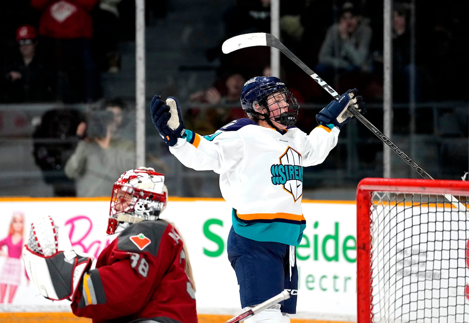 New York Sirens' Sarah Fillier (10) celebrates scoring on Ottawa Charge goaltender Emerance Maschmeyer (38) during the second period of a PWHL hockey game in Ottawa, on Wednesday, Feb. 26, 2025. (Justin Tang/The Canadian Press via AP)