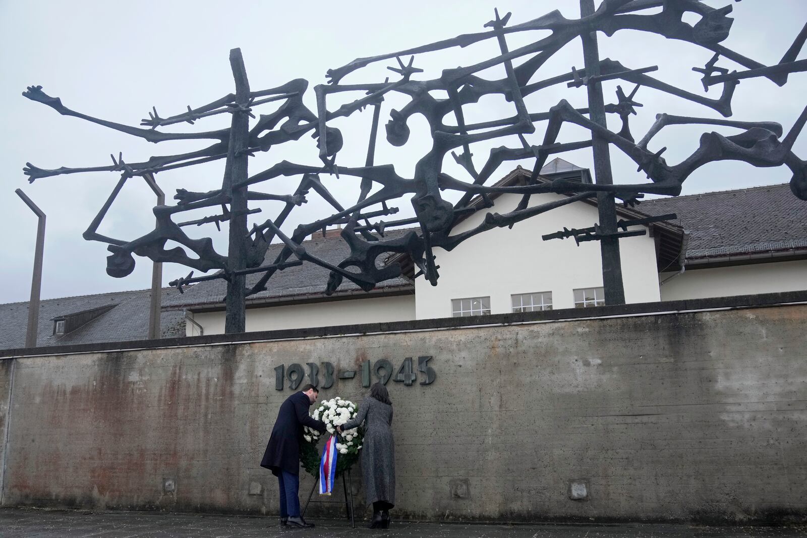 U.S. Vice President JD Vance and second lady Usha Vance lay a wreath at the Dachau Concentration Camp Memorial Site outside Munich, Germany, Thursday, Feb. 13, 2025. (AP Photo/Matthias Schrader)