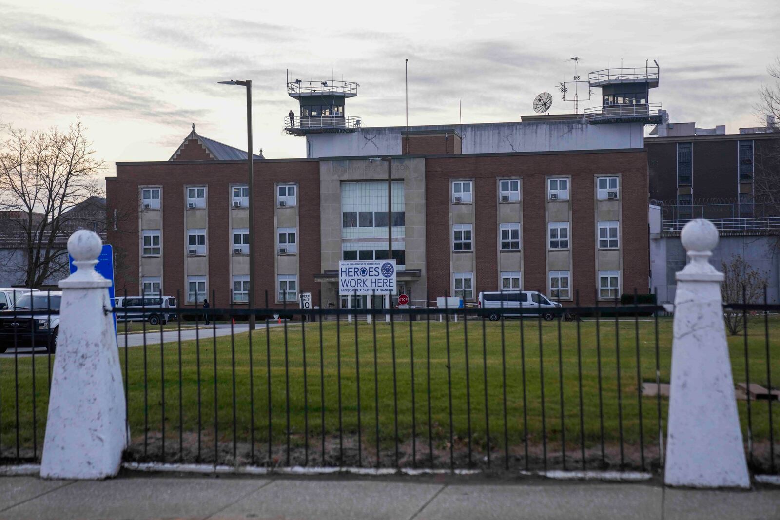 The sun sets behind Indiana State Prison where, barring last-minute court action or intervention by Gov. Eric Holcomb, Joseph Corcoran, 49, convicted in the 1997 killings of his brother and three other people, is scheduled to be put to death by lethal injection before sunrise Tuesday, Dec. 17, 2024, in Michigan City, Ind. (AP Photo/Erin Hooley)