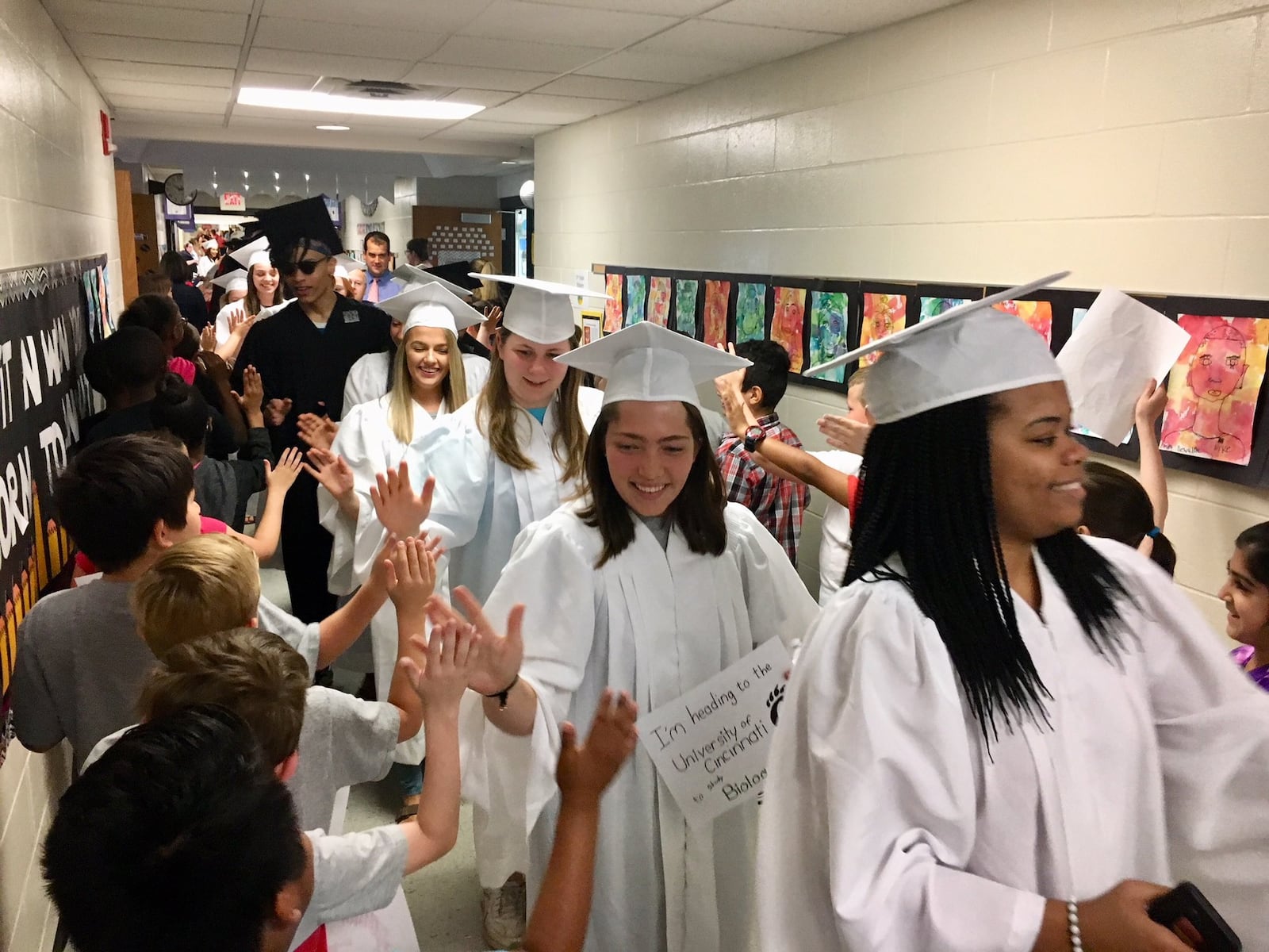 Dozens of soon-to-graduate Lakota East High School seniors paraded through cheering youngsters at Woodland Elementary Thursday as part of a recent and popular spring tradition at Lakota Schools. All 10 of Lakota’s elementary schools put on parades for seniors from both Lakota East and Lakota West. 