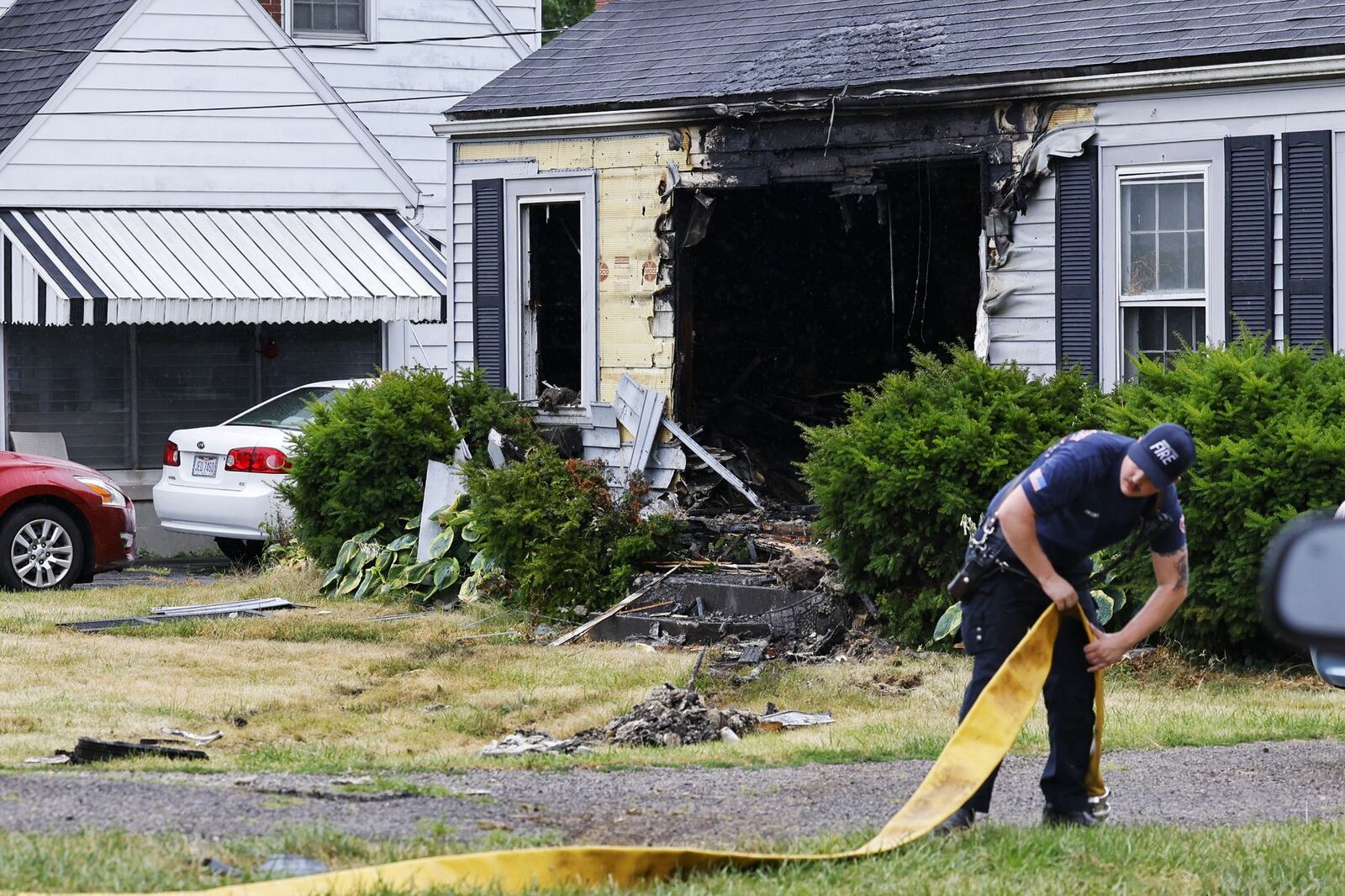 A minivan crashed into a house on Central Avenue and caught fire Wednesday evening, June 26, 2024, in Middletown. NICK GRAHAM/STAFF