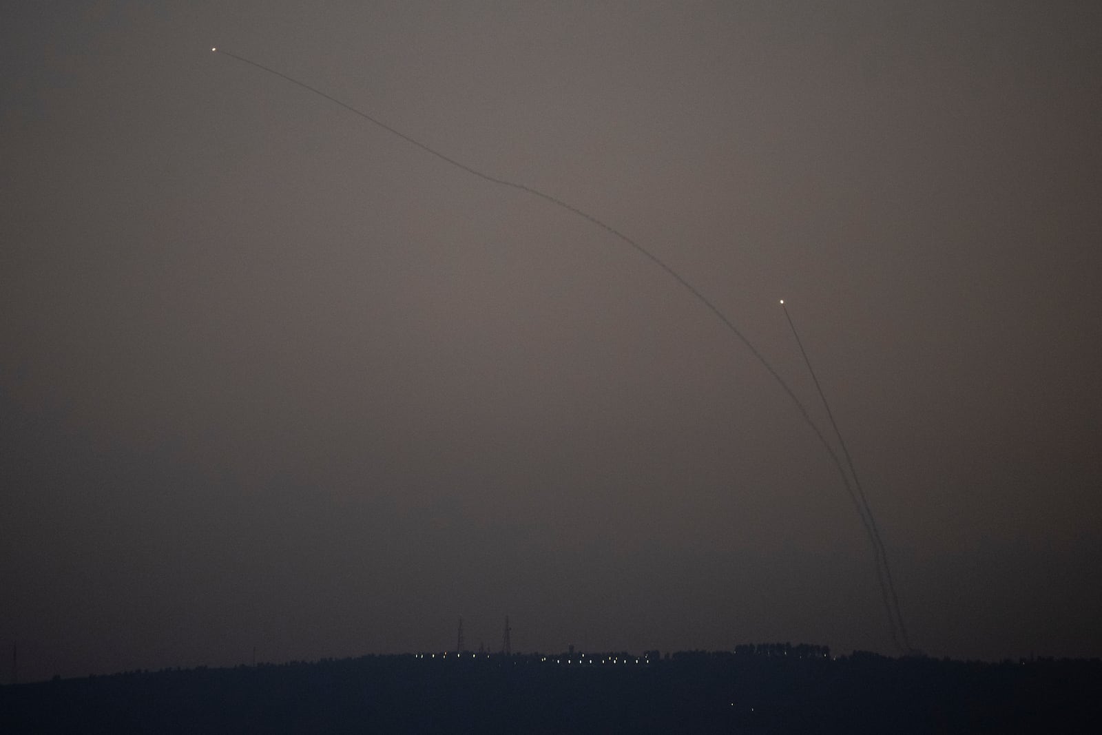 Israeli Iron Dome air defense system fires to intercept rockets that were launched from Lebanon, in northern Israel, Monday, Oct. 14, 2024. (AP Photo/Leo Correa)