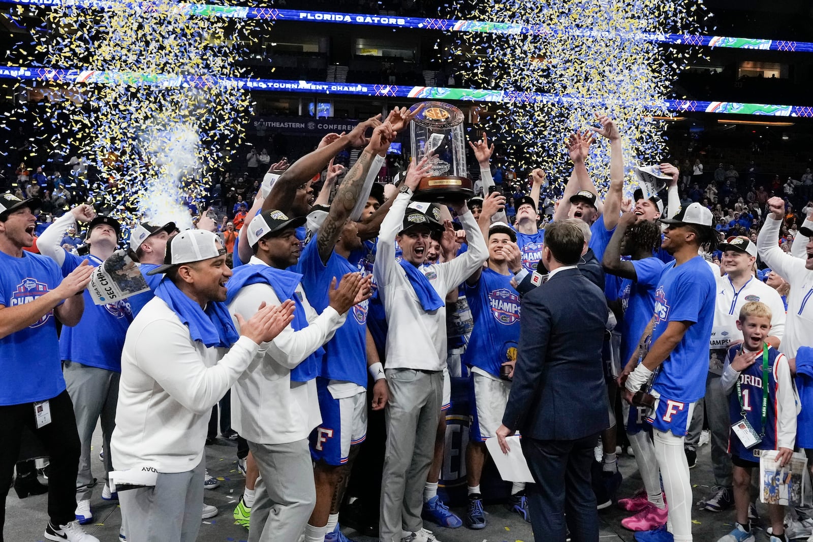 Florida head coach Todd Golden and players celebrate victory over Tennessee after an NCAA college basketball game in the final round of the Southeastern Conference tournament, Sunday, March 16, 2025, in Nashville, Tenn. (AP Photo/George Walker IV)