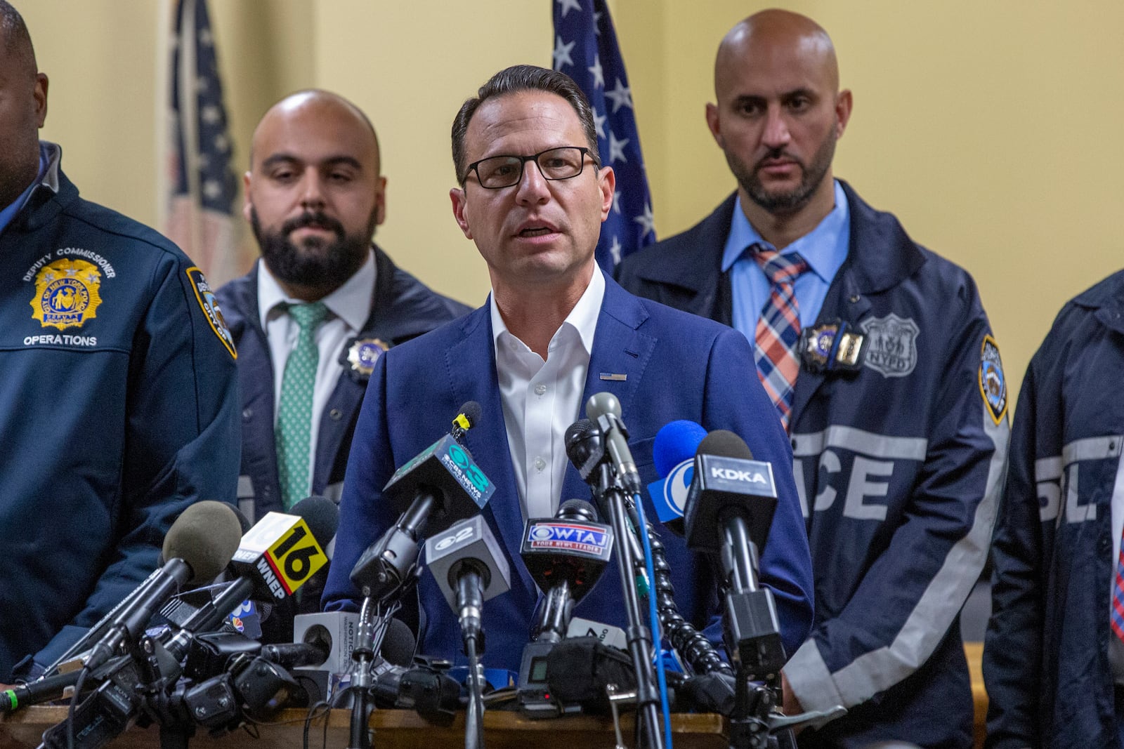 Gov. Josh Shapiro, center, speaks during a press conference regarding the arrest of suspect Luigi Mangione, Monday, Dec. 9, 2024, in Hollidaysburg, Pa., in the fatal shooting of UnitedHealthcare CEO Brian Thompson. (AP Photo/Ted Shaffrey)