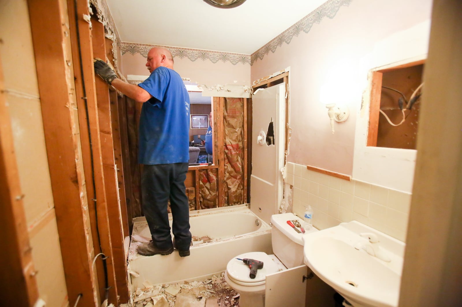 Sam Brock, along with other volunteers from Berachah Church in Middletown, help renovate a bathroom and closet for a wheelchair bound citizen, Thursday, May 18, 2017. GREG LYNCH / STAFF