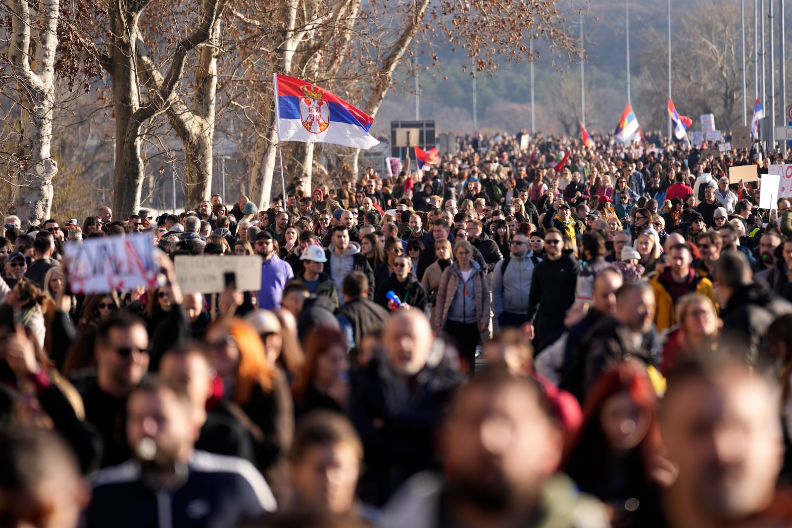 People march during a protest over the collapse of a concrete canopy that killed 15 people more than two months ago, in Novi Sad, Serbia, Saturday, Feb. 1, 2025. (AP Photo/Darko Vojinovic)