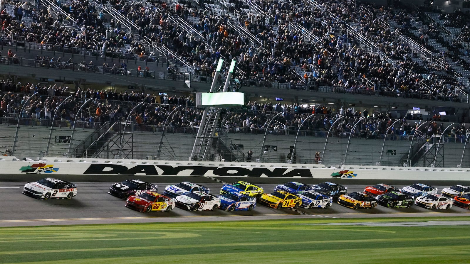 Austin Cindric (2) and Joey Logano (22) lead the field to start the second of two NASCAR Daytona 500 qualifying auto races at Daytona International Speedway, Thursday, Feb. 13, 2025, in Daytona Beach, Fla. (AP Photo/Terry Renna)