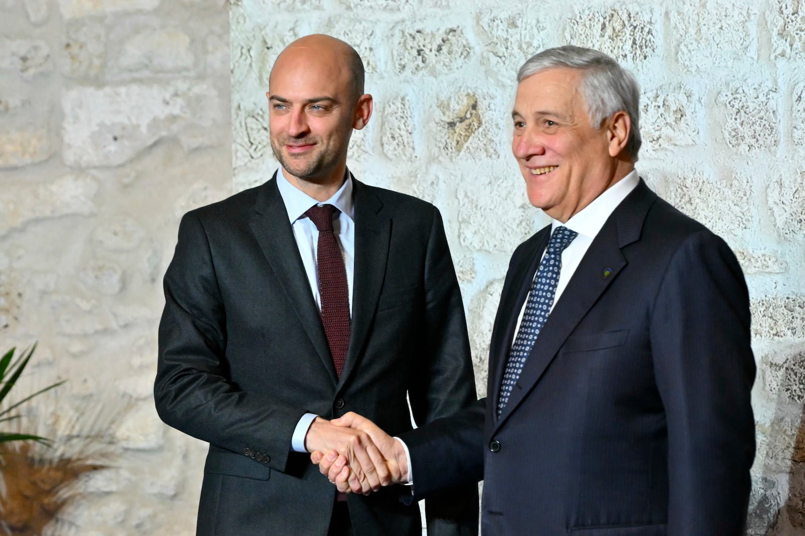 Italy's Foreign Minister Antonio Tajani, right, welcomes France's Foreign Affairs Minister Jean-Noel Barrot at the G7 Foreign Ministers meeting in Anagni, central Italy, Monday, Nov. 25, 2024. (Andreas Solaro/Pool Photo via AP)