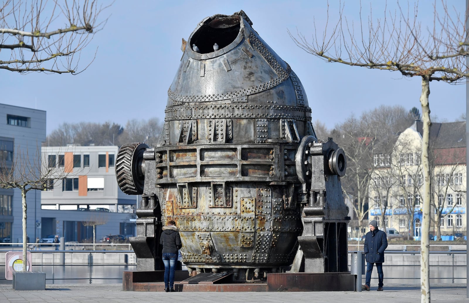 FILE - A giant Thomas converter, once used to produce steel, remembers the old history of heavy industries at the Phoenix lake in Dortmund, Germany, Wednesday, Feb. 21, 2018. (AP Photo/Martin Meissner, File)