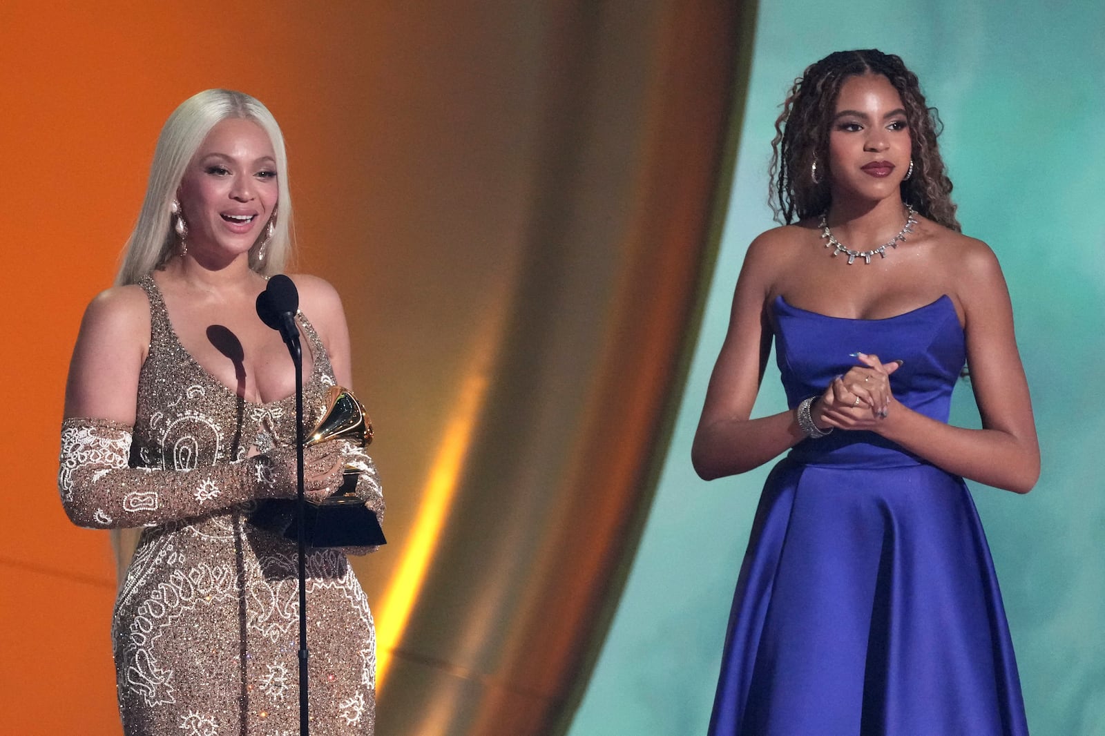 Beyonce accepts the award for album of the year for "COWBOY CARTER during the 67th annual Grammy Awards on Sunday, Feb. 2, 2025, in Los Angeles. Blue Ivy Carter looks on from right.(AP Photo/Chris Pizzello)