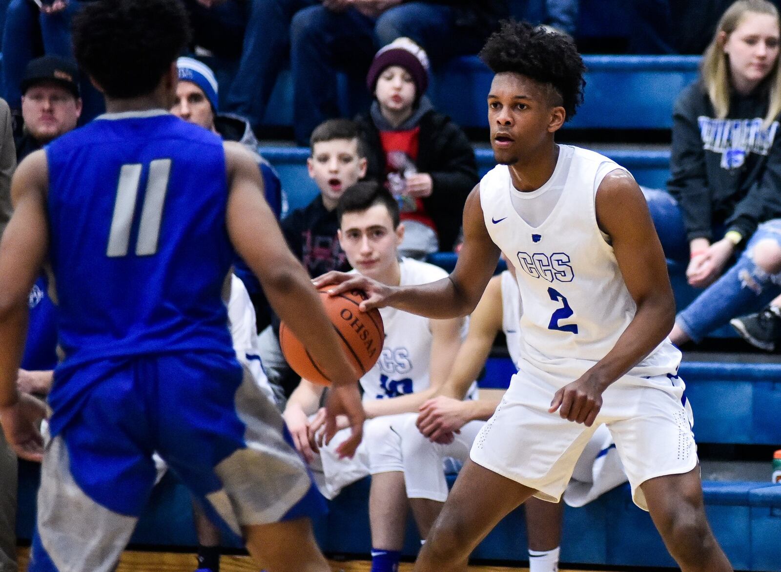 Cincinnati Christian’s Miguel Ringer dribbles the ball as Summit Country Day’s Terry Evans (11) defends during Friday night’s game in Fairfield Township. CCS won 44-35. NICK GRAHAM/STAFF