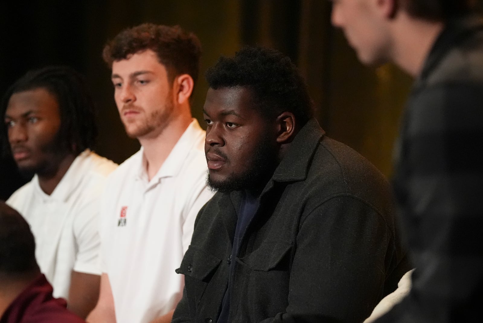 College football player Kardell Thomas listens as others speak during a players association for college athletes meeting ahead of the college football's national title game, Saturday, Jan. 18, 2025, in Atlanta. (AP Photo/Brynn Anderson)