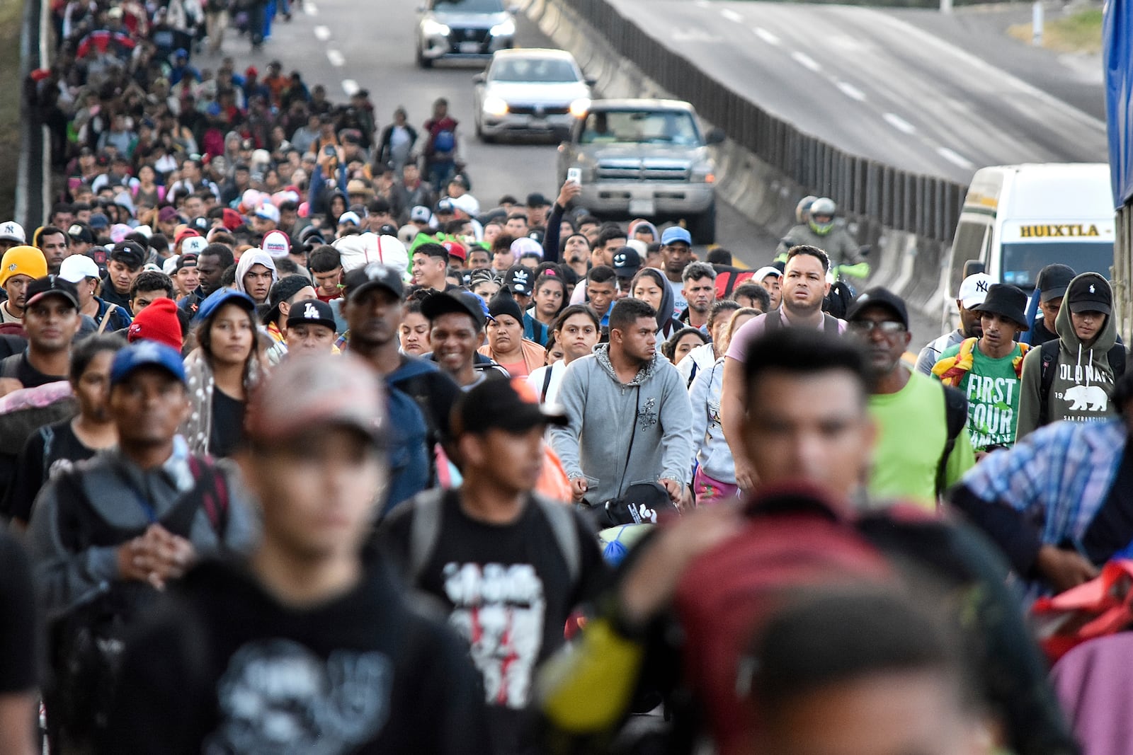 Migrants walk through Tapachula, Chiapas state, Mexico, Monday, Jan. 20, 2025, in an attempt to reach the U.S. border. (AP Photo/Edgar H. Clemente)