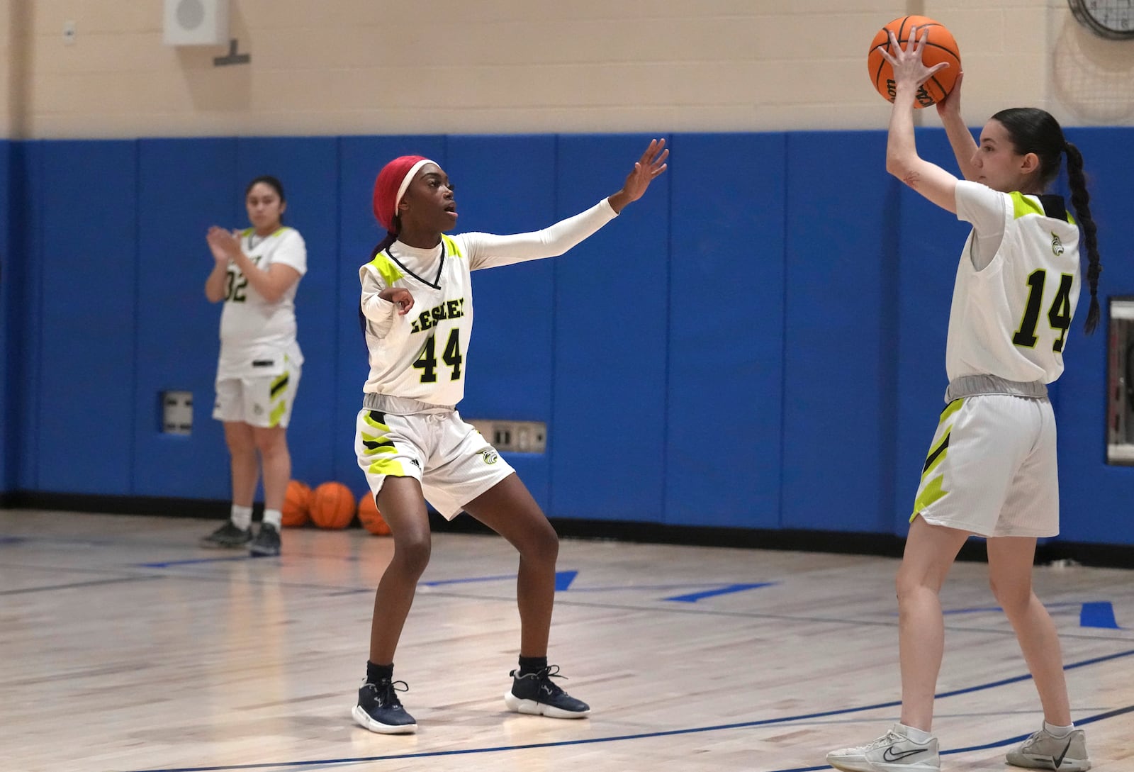 Lesley College basketball player Baileigh Sinaman-Daniel (44) pressures teammate Leila Chisholm while practicing prior to game, Tuesday, Feb. 11, 2025, in Lexington, Mass. (AP Photo/Charles Krupa)