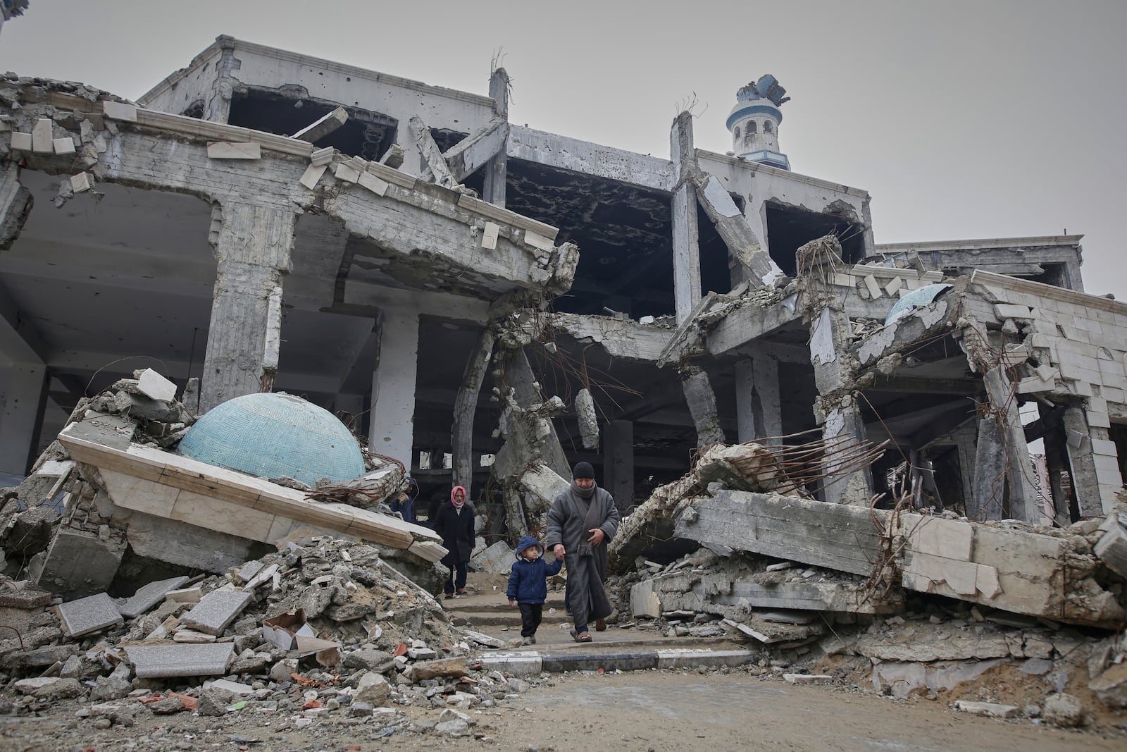 Palestinians leave after attending the first Friday prayers of the Muslim holy month of Ramadan at the Imam Shafi'i Mosque, damaged by Israeli army strikes, in the Zeitoun neighborhood in Gaza City, Friday March 7, 2025.(AP Photo/(AP Photo/Jehad Alshrafi)