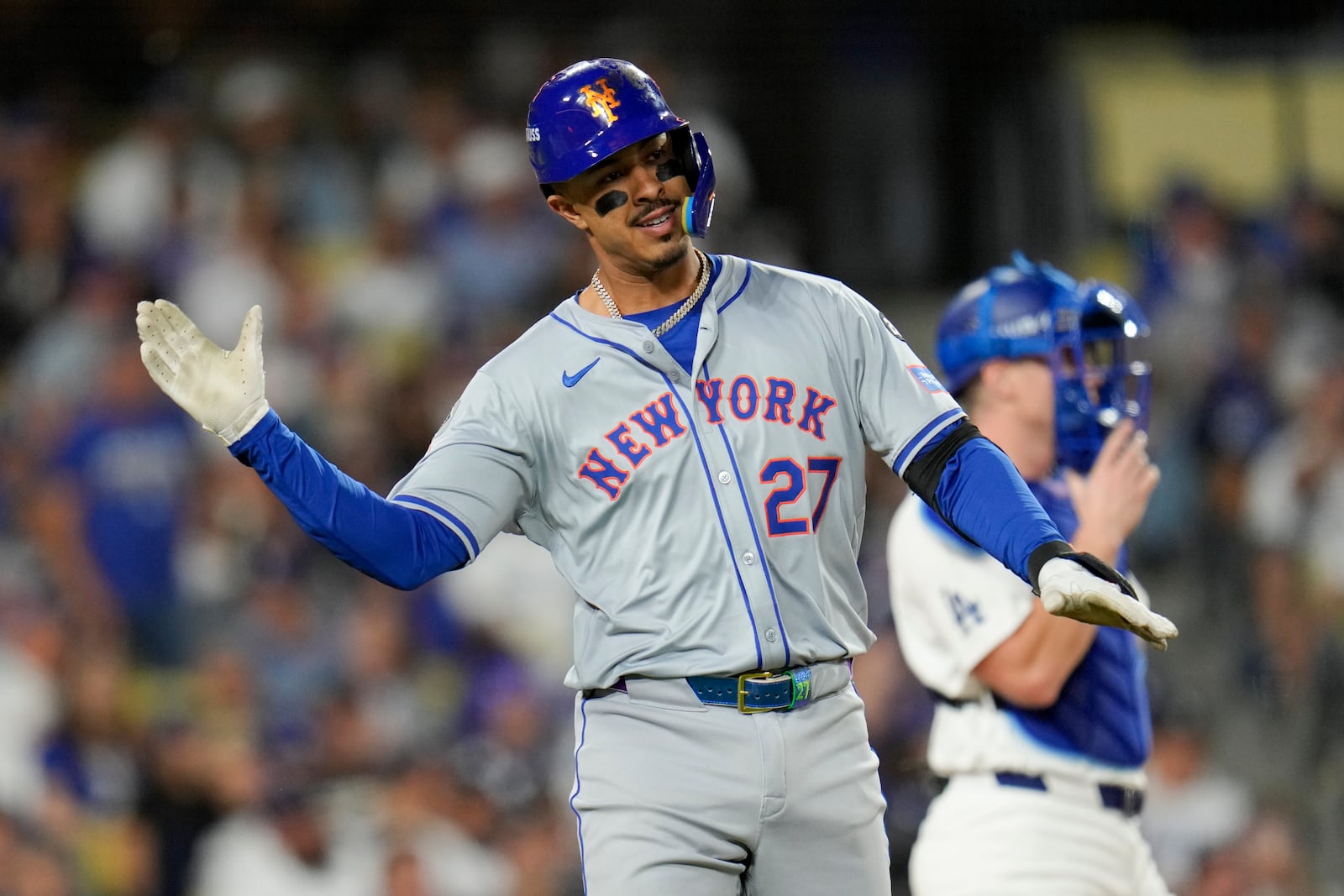 New York Mets' Mark Vientos celebrates a two-run home run during fourth inning of Game 6 in a baseball NL Championship Series against the Los Angeles Dodgers, Sunday, Oct. 20, 2024, in Los Angeles. (AP Photo/Julio Cortez)