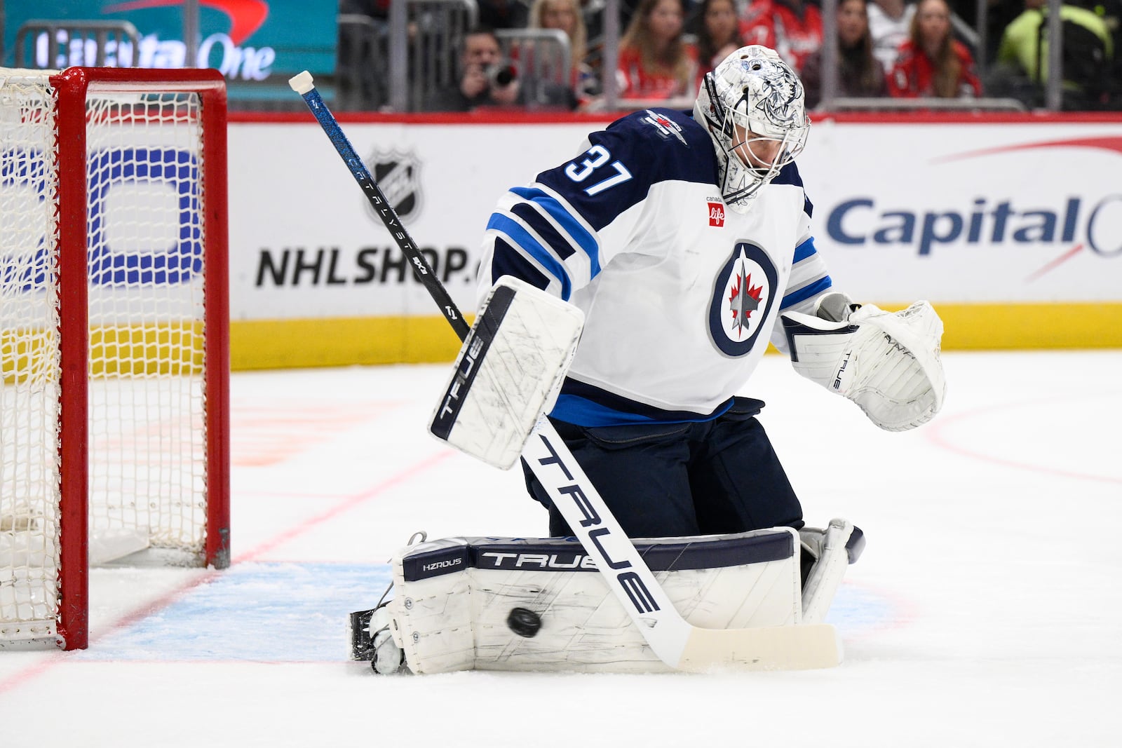 Winnipeg Jets goaltender Connor Hellebuyck stops the puck during the first period of an NHL hockey game against the Washington Capitals, Saturday, Feb. 1, 2025, in Washington. (AP Photo/Nick Wass)