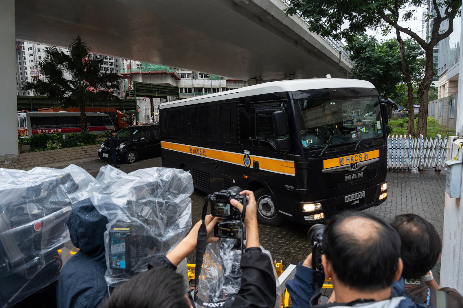 A Correctional Services Department vehicle arrives at the West Kowloon Magistrates' Courts in Hong Kong Tuesday, Nov. 19, 2024, ahead of the sentencing in national security case. (AP Photo/Chan Long Hei)