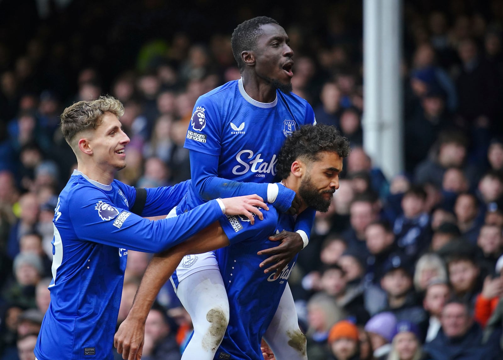 Everton's Dominic Calvert-Lewin, right, celebrates after scoring the opening goal during the English Premier League soccer match between FC Everton and Tottenham Hotspur, in Liverpool, England, Sunday, Jan. 19, 2025. (Peter Byrne/PA via AP)